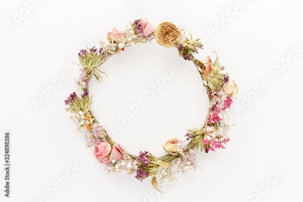 Fototapeta Minimal style photography. Dry flowers circle natural creative composition top view background with copy space for your text. Flat lay.