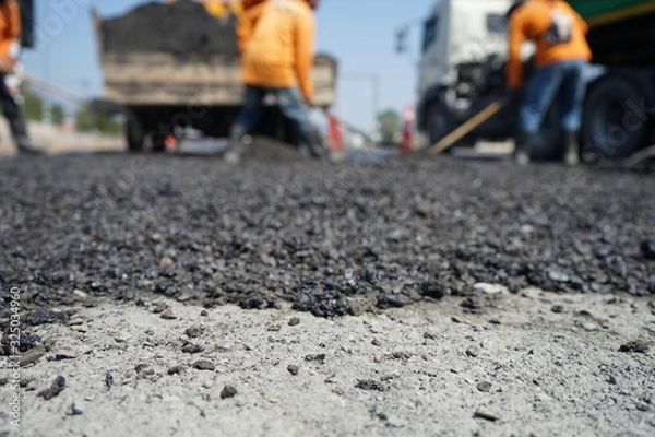Fototapeta Blur image, repairing pavement mainly by manual labor