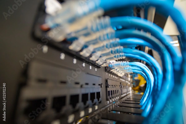 Obraz Blue network cable system in network rack