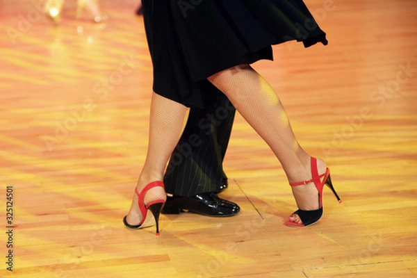 Obraz Graceful lines of legs of Argentina tango dancers