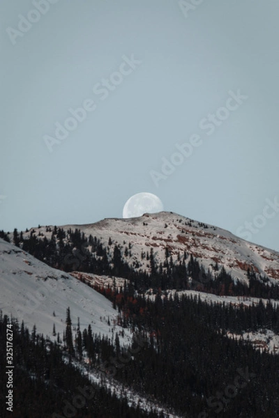 Obraz Moon Setting over the Mountainous Horizon