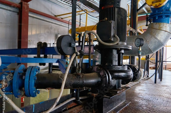 Fototapeta Engine with pump and manometer on the pipeline.