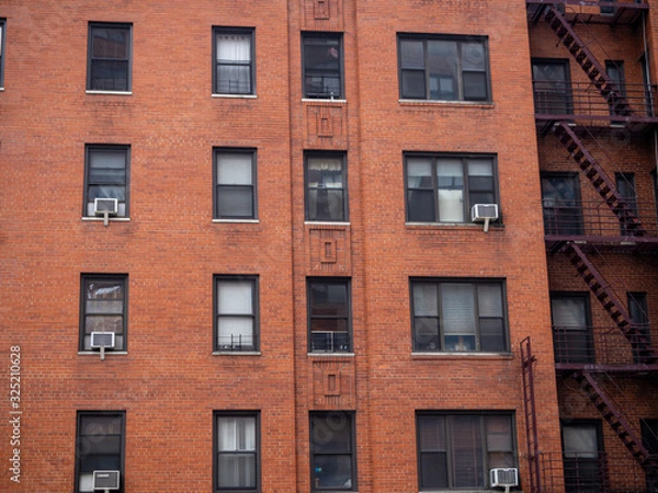 Fototapeta close view of classic brick facade from building in New York City