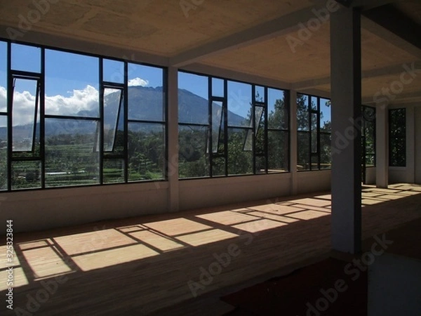 Obraz glass window frame with a mountain background