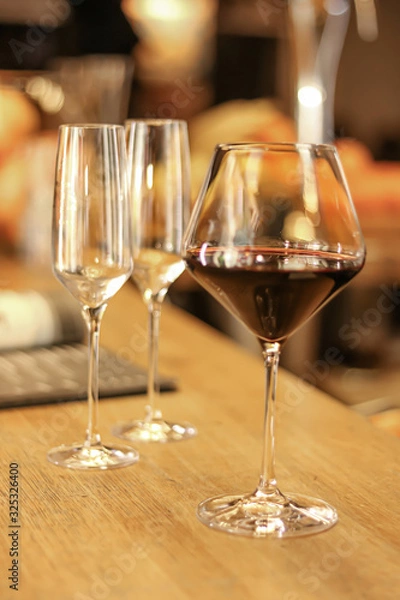 Fototapeta a glass of red wine at the bar