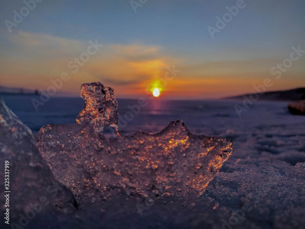Obraz Beautiful winter sunset through the ice