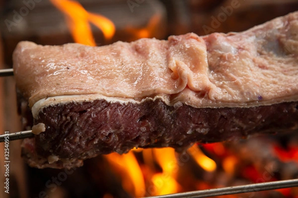 Obraz Brazilian traditional barbecue "churrasco". Close-up of roasted meat