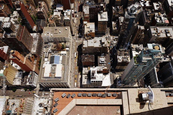 Fototapeta Manhattan midtown top view with big skyscrapers, New York City, USA. Top of the buildings in financial district, NYC panorama. Business background. Down streets view.