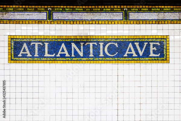 Fototapeta New York City Atlantic Avenue subway station with mosaic plate sign. New York City, USA name tile pattern in subway station, Manhattan metropolitan, NYC.