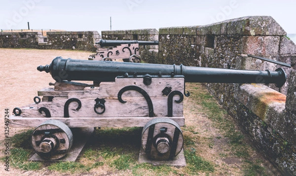 Obraz Historic military artillery gun at Pendennis castle was first commissioned by King Henry VIII in response to invasion threats from the continent.