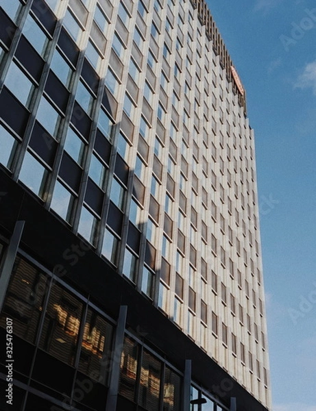 Obraz Large office building from low angle with blue sky Liverpool