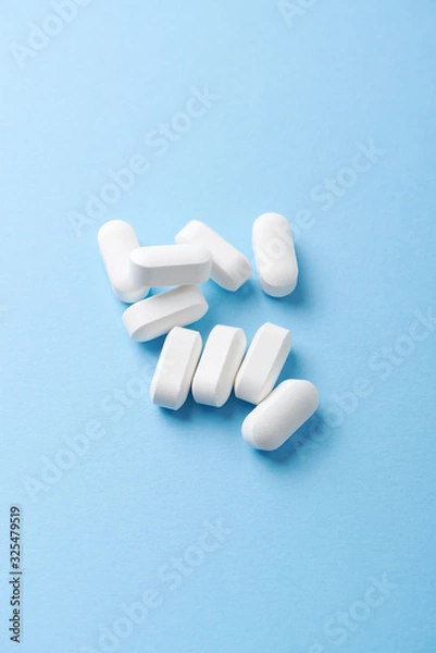 Obraz BCAA amino acids. Nutrition for bodybuilding. Fitness supplements on bright paper background. Copy space. 