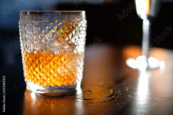 Obraz Old fashioned whiskey cocktail on wooden table 