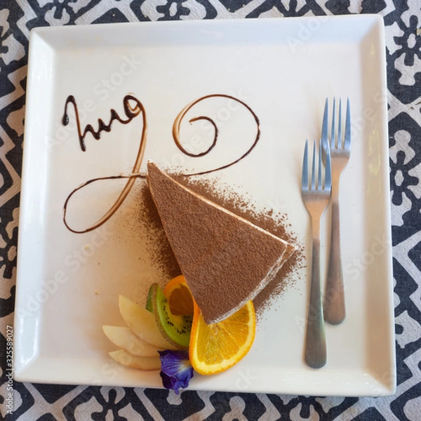 Obraz top view Tiramisu on chocolate cake