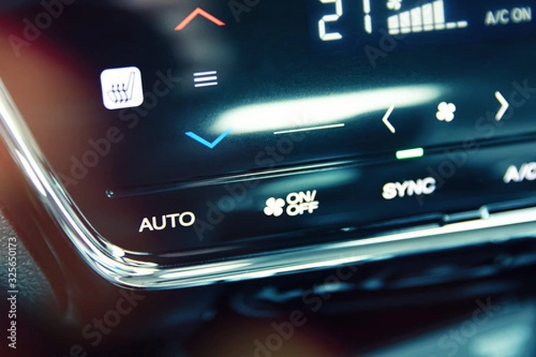 Fototapeta Automatic air conditioning touch panel and close-up to AUTO button