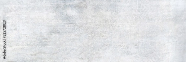 Fototapeta Texture of a smooth white concrete wall with cracks as a background or wallpaper