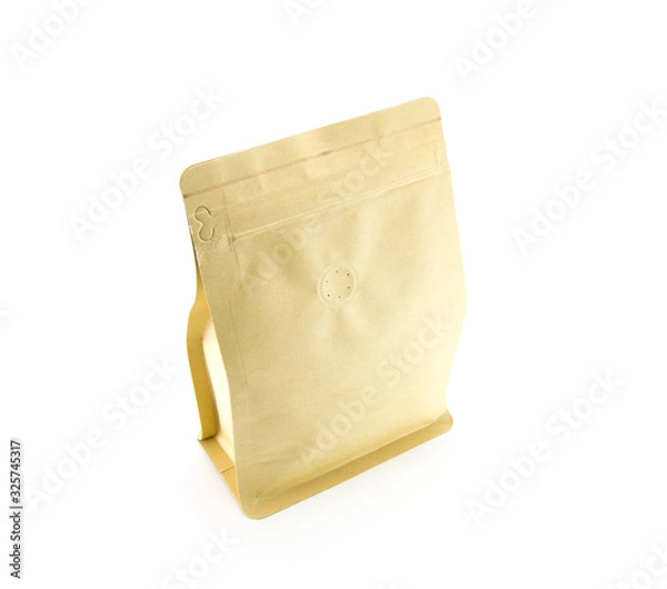 Fototapeta Light brown craft paper bag with coffee grains. Tightly closed with small odor holes. On a white isolated background. Stands upright.