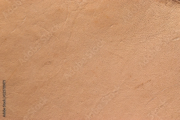 Fototapeta Natural vegetable tanned leather closeup macro full frame texture showing top grain and scratch wear marks