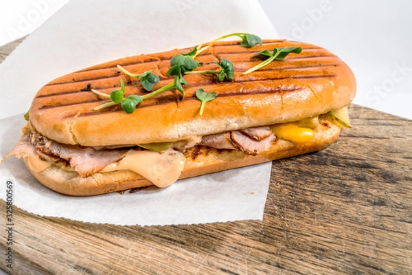 Fototapeta Panini with ham, cheese and soybean seedlings