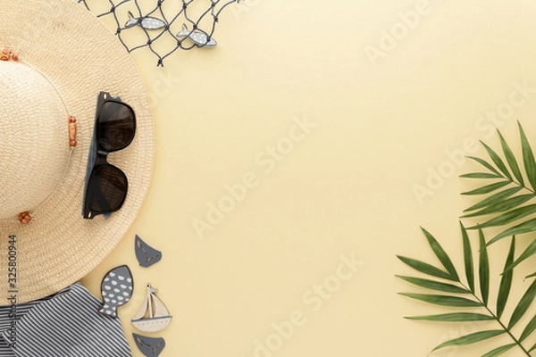 Fototapeta Holidays Travel. Straw hat sunglasses palm leaf , summer background with copy space for your text. Flat lay, top view.
