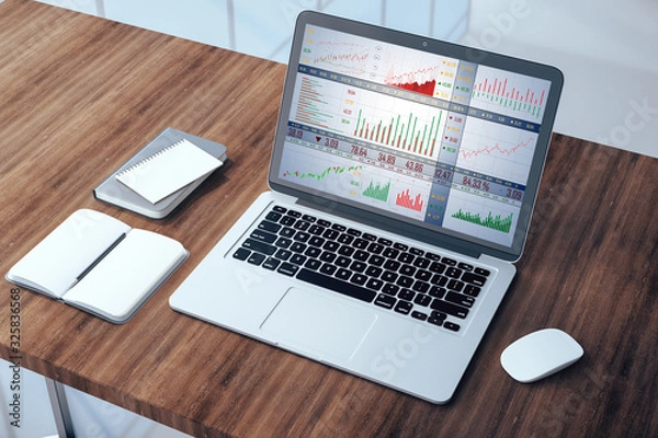 Fototapeta Top view laptop with stock chart on screen