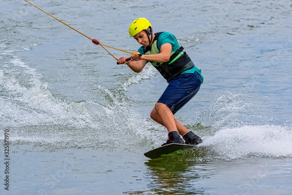 Obraz Teenager wakeboarding on a lake - Brwinow, Masovia, Poland