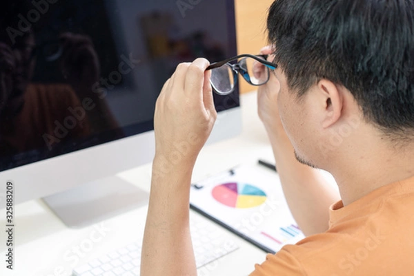 Obraz Tired Asian men work at home