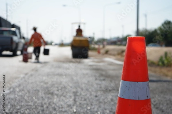 Fototapeta Red rubber cone in road construction And background blur