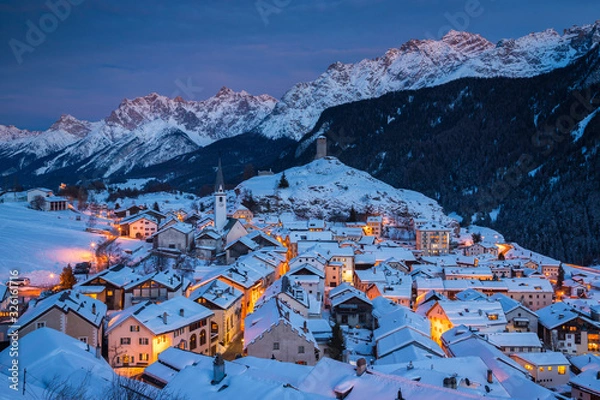 Fototapeta the Swiss village of Ardez covered by snow during the winter, Switzerland