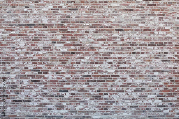 Fototapeta Brick wall with different color bricks