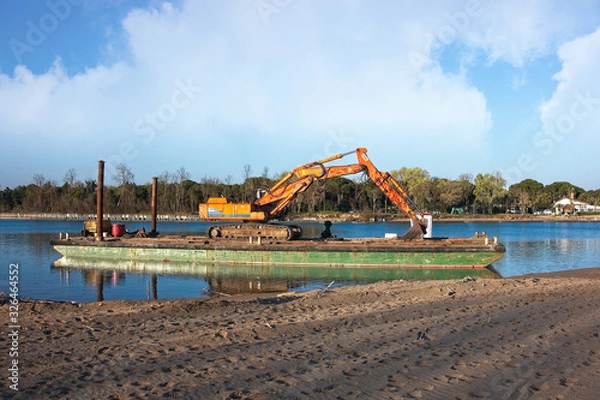 Obraz Excavator for channel dredge on a barge.