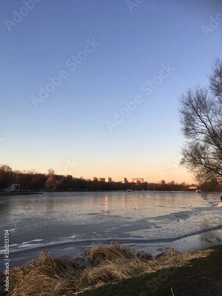 Fototapeta sunset over the river