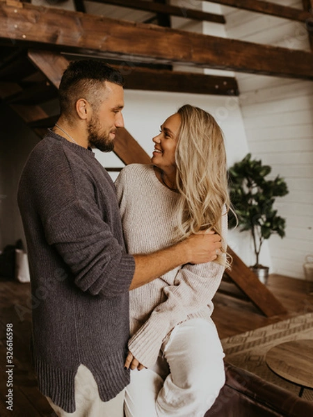 Obraz Beautiful loving couple hugging each other and kissing, natural light and authentic emotion