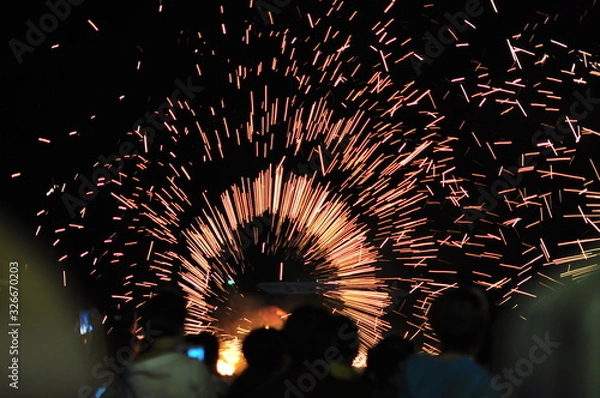 Fototapeta Fire show performance at a beachfront restaurant in Thailand tourist attraction