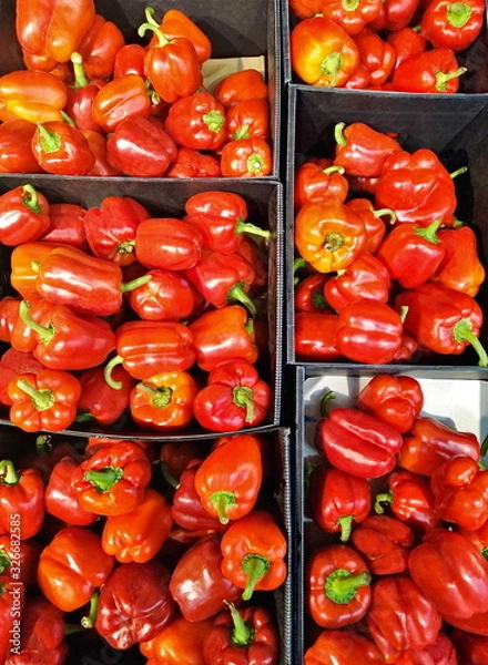Fototapeta red pepper in a box on shelves in a supermarket