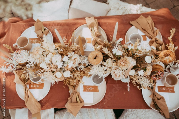 Fototapeta boho table scape with donuts