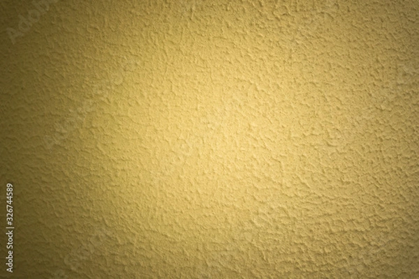 Fototapeta abstract yellow concrete wall background, sunbeam in shadow
