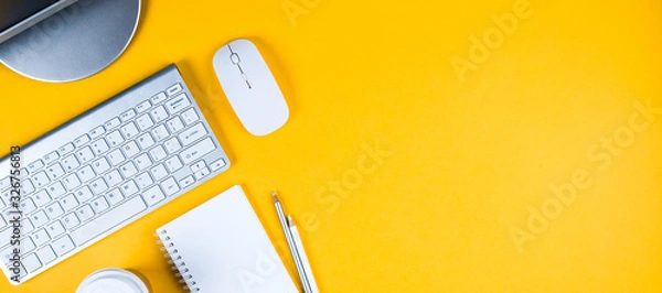 Fototapeta White keyboard, mouse and Notepad on yellow background. Flat lay and top view, copy space for text