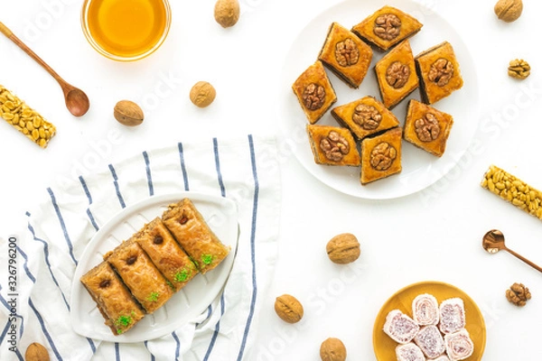 Obraz Arabic sweets on white background, flat lay, top view