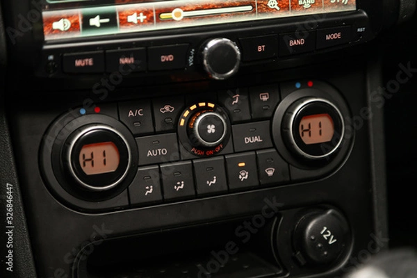 Fototapeta Car, vehicle interior with visible climate controls, adjustment of the fragment of instrument panel..