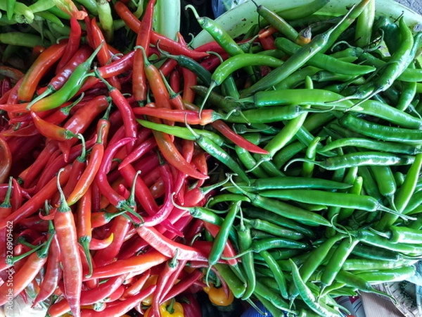 Obraz Closeup of red and green chillis for sale in the market.  Food ingredient concept.