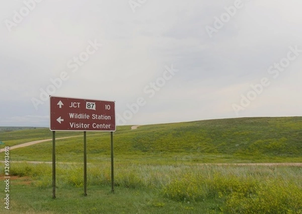 Obraz Roadside sign with directions to the Wildlife Station Visitor Center and Junction 87 at Wildlife Loop Road, Custer State Park, South Dakota