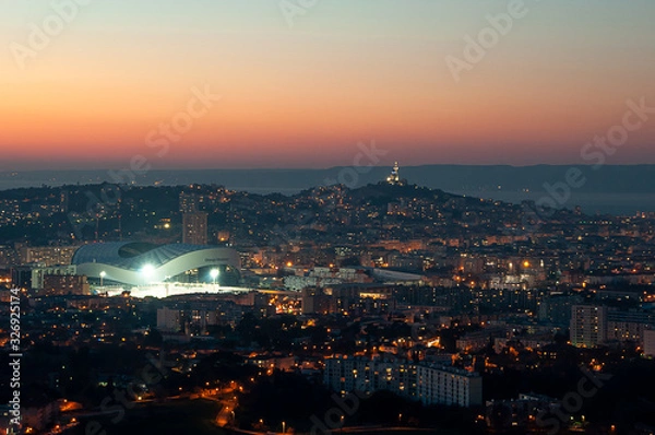Obraz Panoramic shot of the city of Marseille and Orange Velodrome stadium at sunset and golden hour from the hills around the town