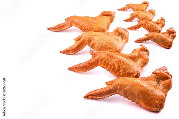 Fototapeta smoked chicken wings on a white isolated background space for text