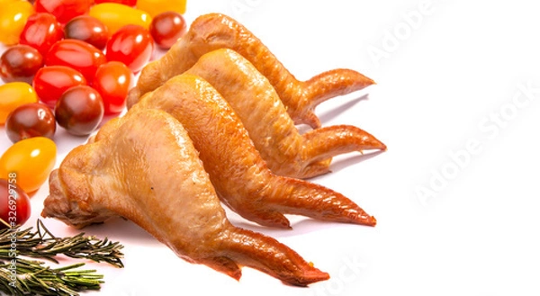 Fototapeta smoked chicken wings, cherry tomatoes on a white isolated background