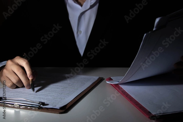 Fototapeta Employees are checking document validity.