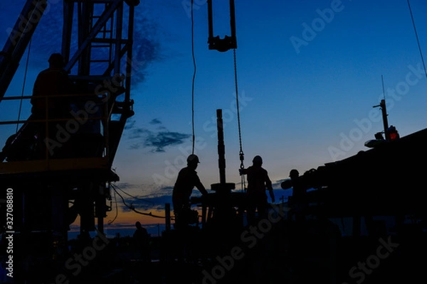 Fototapeta field oil workers at work