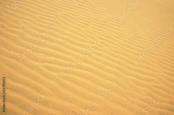 Fototapeta Ripple golden desert sand as background. Sand texture. Pattern, Decoration, Wallpaper.