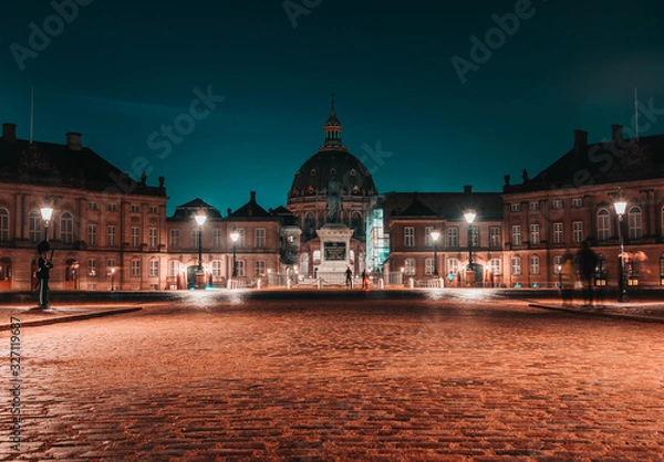 Fototapeta Night long exposure panoramic view after rain of Amalienborg winter residence 18th-century rococo complex of palaces with museum & marches/displays by royal guards in Copenhagen, Denmark. 