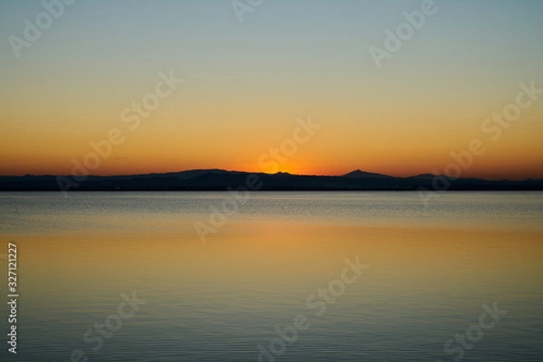 Obraz orange sunset on a lake 